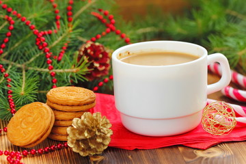 Obraz na płótnie Canvas Cup of coffee with Christmas sweetness
