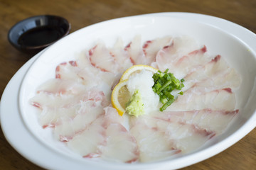 Kampachi sashimi with Shoyu sauce, Japanese cuisine.
