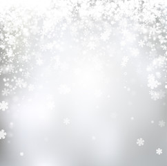 Naklejka na ściany i meble Blurred winter background with snowflakes.