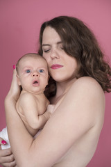 Obraz na płótnie Canvas Cute newborn baby hand holding mother