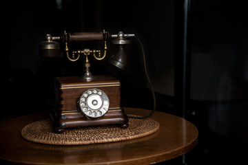 Fototapeta na wymiar Old fashioned wooden telephone, retro styled 