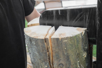 Firewood split with wooden splitter