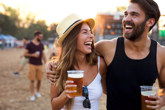 Young couple enjoying music concert