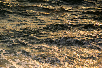 Photograph of a wave on sea during the windy day background.