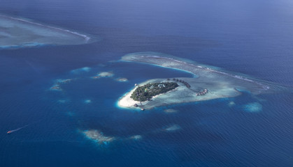 Naklejka premium A Maldivian Air Taxi water plain is waiting to accept passengers.