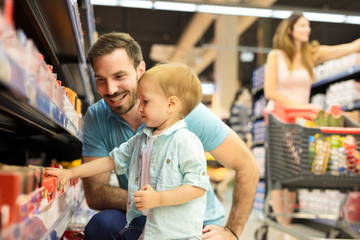 Young family buying in store