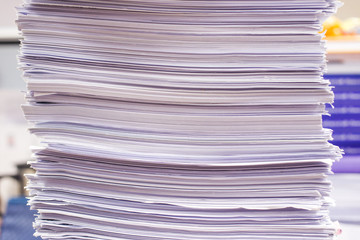 Pile of papers and document stacked on the table close up.