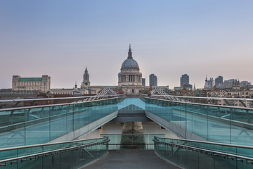 St Paul's Cathedral seen from Millenium Bridge in London, the UK at the sunrise