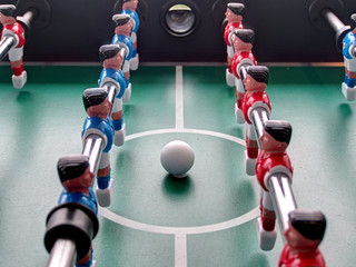 A close-up view of a foosball table             