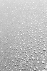 Surface with water drops, grey background