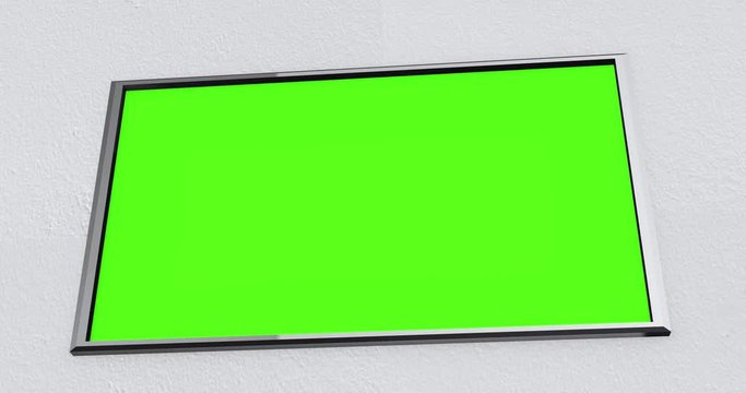 Camera pans across modern flatscreen 4K UHD TV on wall