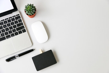 Top view,Flat lay workspace with mock up Notebook and Laptop on the desk copy space for your text.