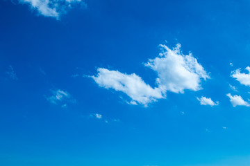 Fototapeta na wymiar Brilliant blue sky background with a tiny clouds in daylight.