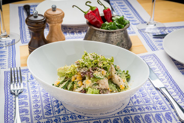 Cesar salad with roasted chicken meat
