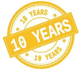 10 YEARS , written text on yellow round rubber stamp.