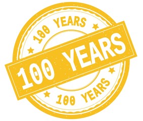 Obraz premium 100 YEARS , written text on yellow round rubber stamp.
