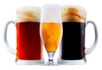 Mug collection of frosty dark red and light beer with foam isolated on a white background