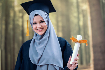 Girl wearing hijab graduation concept