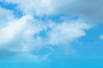 The blue backdrop has some clouds.