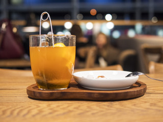 Tea in a transparent cup with orange slices