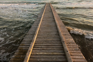 dock on the sea during sunset