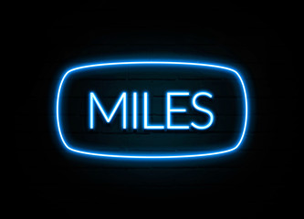 Miles  - colorful Neon Sign on brickwall