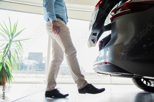 Close Up Of Male Adult Person Legs Opening A Car Door With