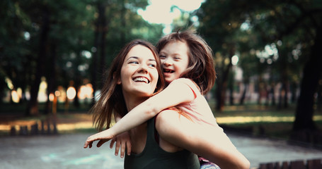 Little girl with special needs enjoy spending time with mother
