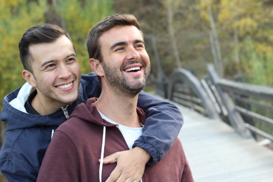 Gay couple enjoying the park in autumn