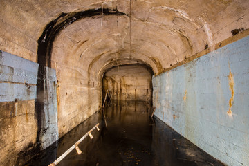 Underground mine shaft iron ore tunnel gallery with flooded water