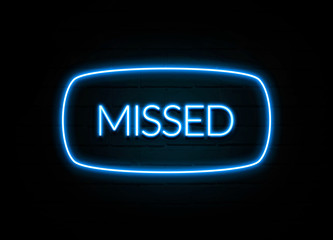 Missed  - colorful Neon Sign on brickwall