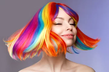 Foto auf Acrylglas Friseur Woman hair as color splash. Rainbow up do short haircut. Beautiful young girl model with glowing  healthy skin.