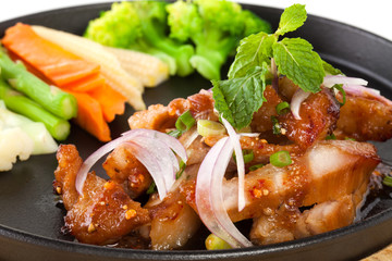 pork neck grill isolated on black plate on white background (Thai style food)