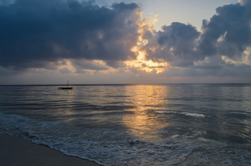 Dhow on the ocean at sunrise