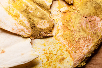 Rotten bread on table.