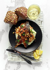 Sicilian style mackerel on cauliflower puree with caramelized onions, pine nuts served with rustic bread and white wine