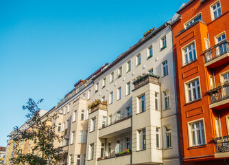 white and red houses in berlin with copy space sky