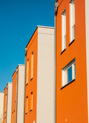red and white townhouses with modern facade