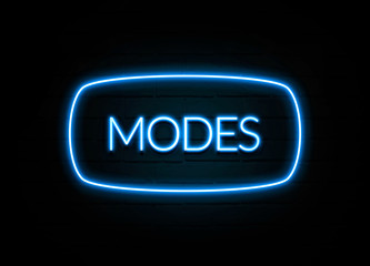 Modes  - colorful Neon Sign on brickwall