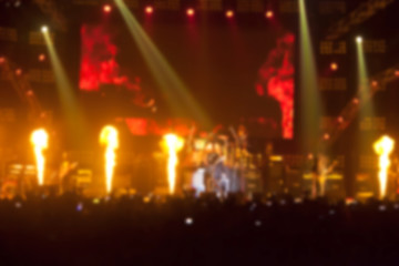 Fototapeta na wymiar blurry image background of musicians rock in big rock concert.