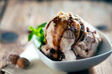 Fresh hazelnut ice cream on plate close up