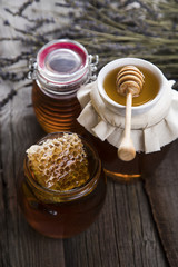 Jar full of fresh honey and honeycombs