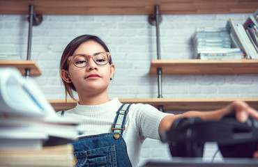 Asian women are prepared to learn attentively.Focus on the face
