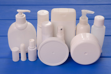 vials of cosmetics, cosmetic bottles, assortment of cosmetic flasks, health and beauty