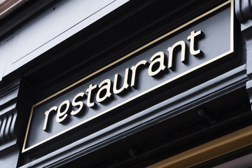 Obraz premium label restaurant on a shop