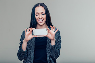 women making photo on mobile phone, female taking pictures with phone camera