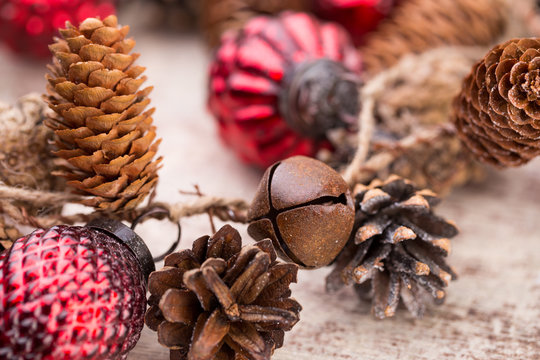 Christmas cone with red berries on a bokeh background.