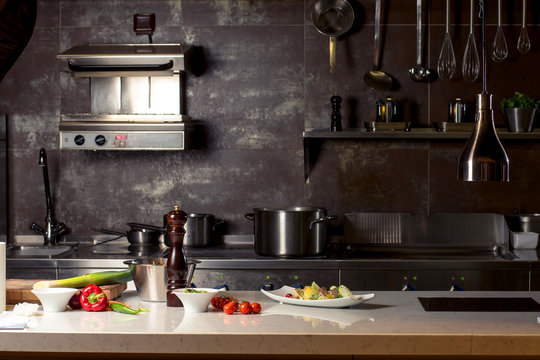 Variety Of Utensils On Counter In Commercial Kitchen