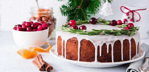 Christmas fruit cake, pudding on white plate. Copy space.