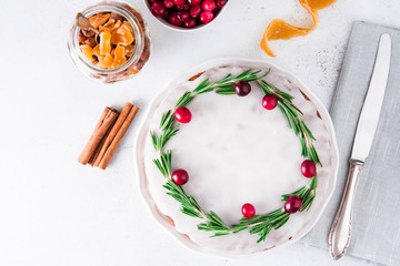 Christmas fruit cake, pudding on white plate. Copy space.